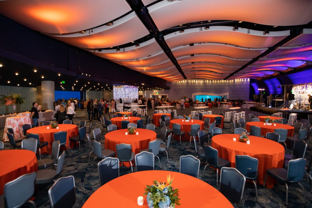 A hall with dining tables and chairs. In red.