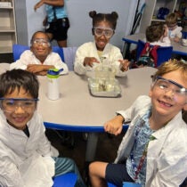 young students participating in science experiment